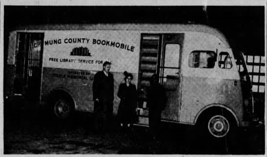 The first Chemung County Bookmobile with its first driver, Thompson Williams (Right) and the extension librarian, Marion MacRorie.